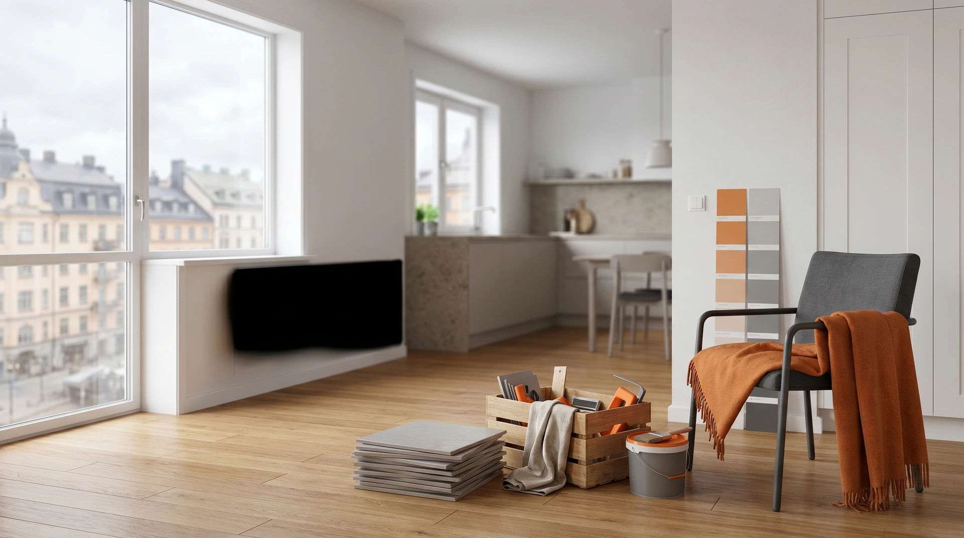 Ljust vardagsrum under renovering med färgprover, möbler och byggmaterial på golvet.